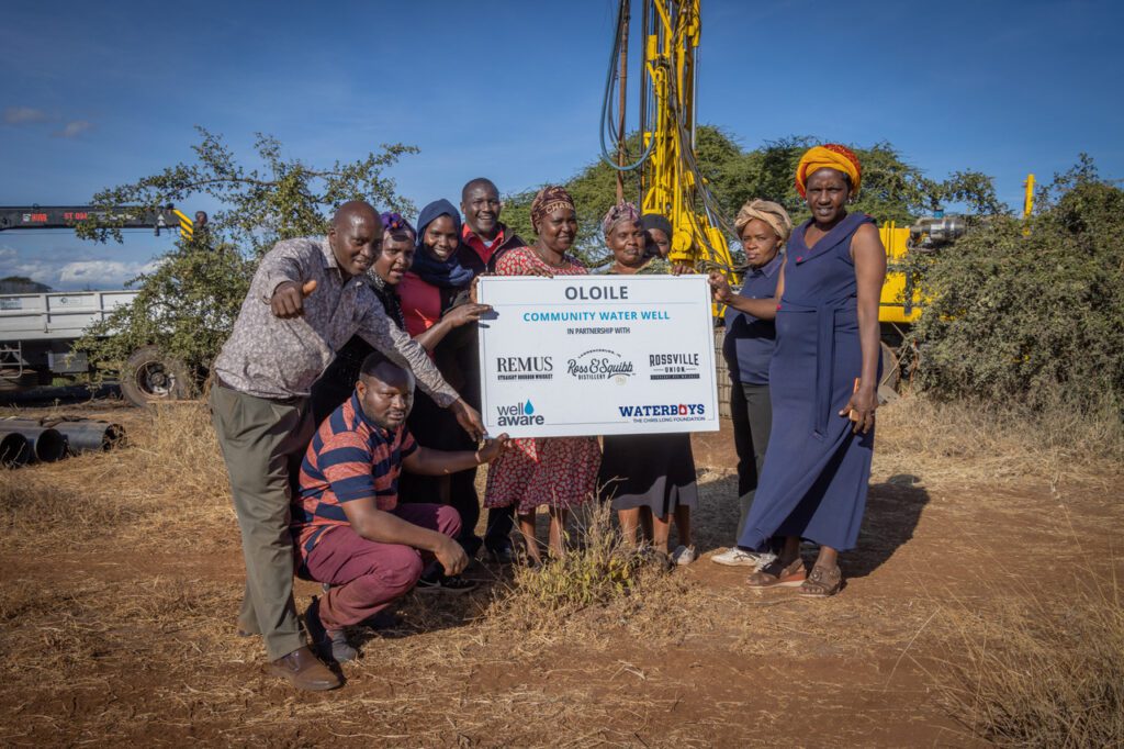 Group of people holding a check