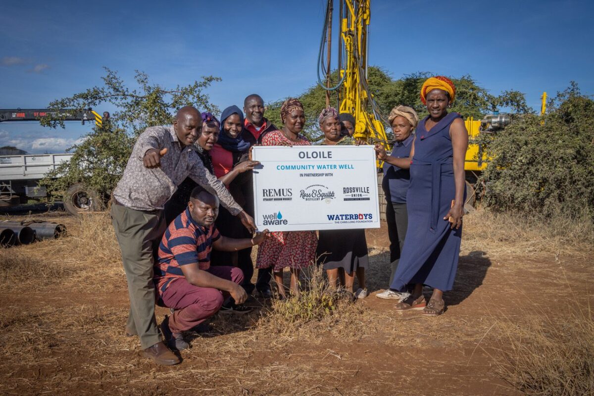 Group of people holding a check