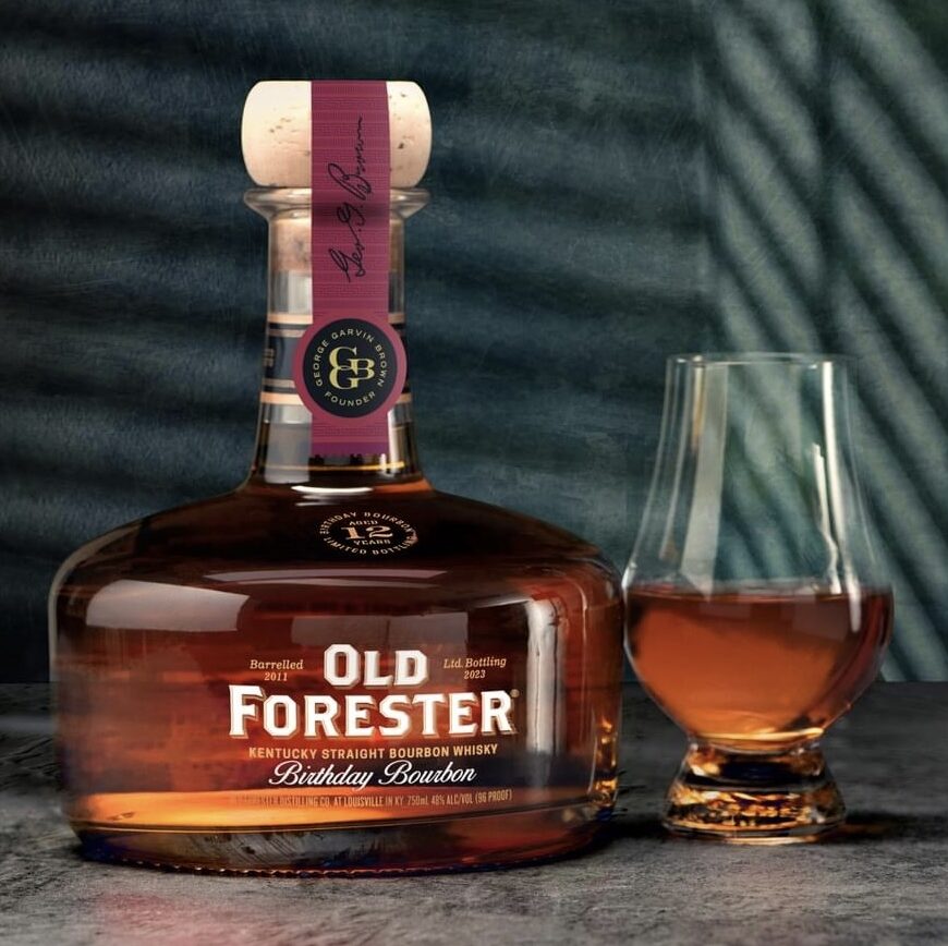 An image of the bottle of Old Forester Birthday Bourbon 2023 Release with a glass of whiskey.
