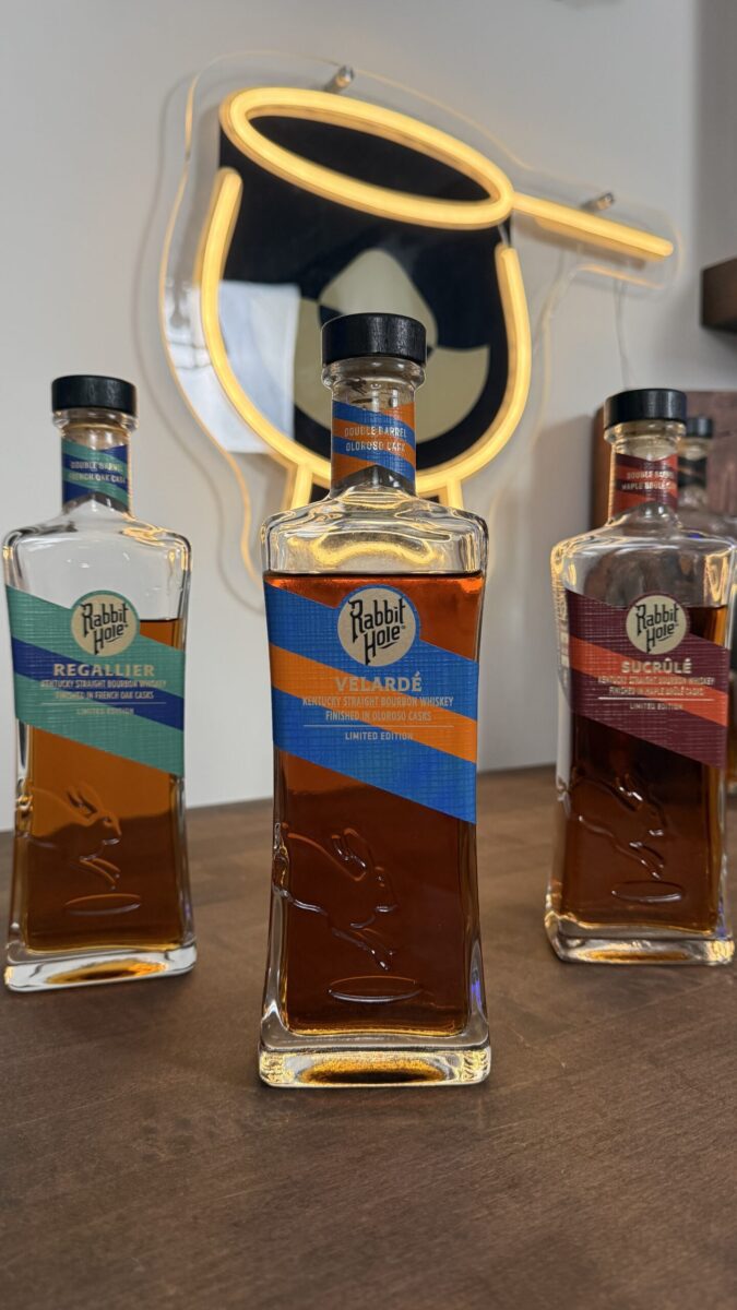 Rabbit Hole Distillery Exclusives Bottles With Bourbon Lens Logo in the background