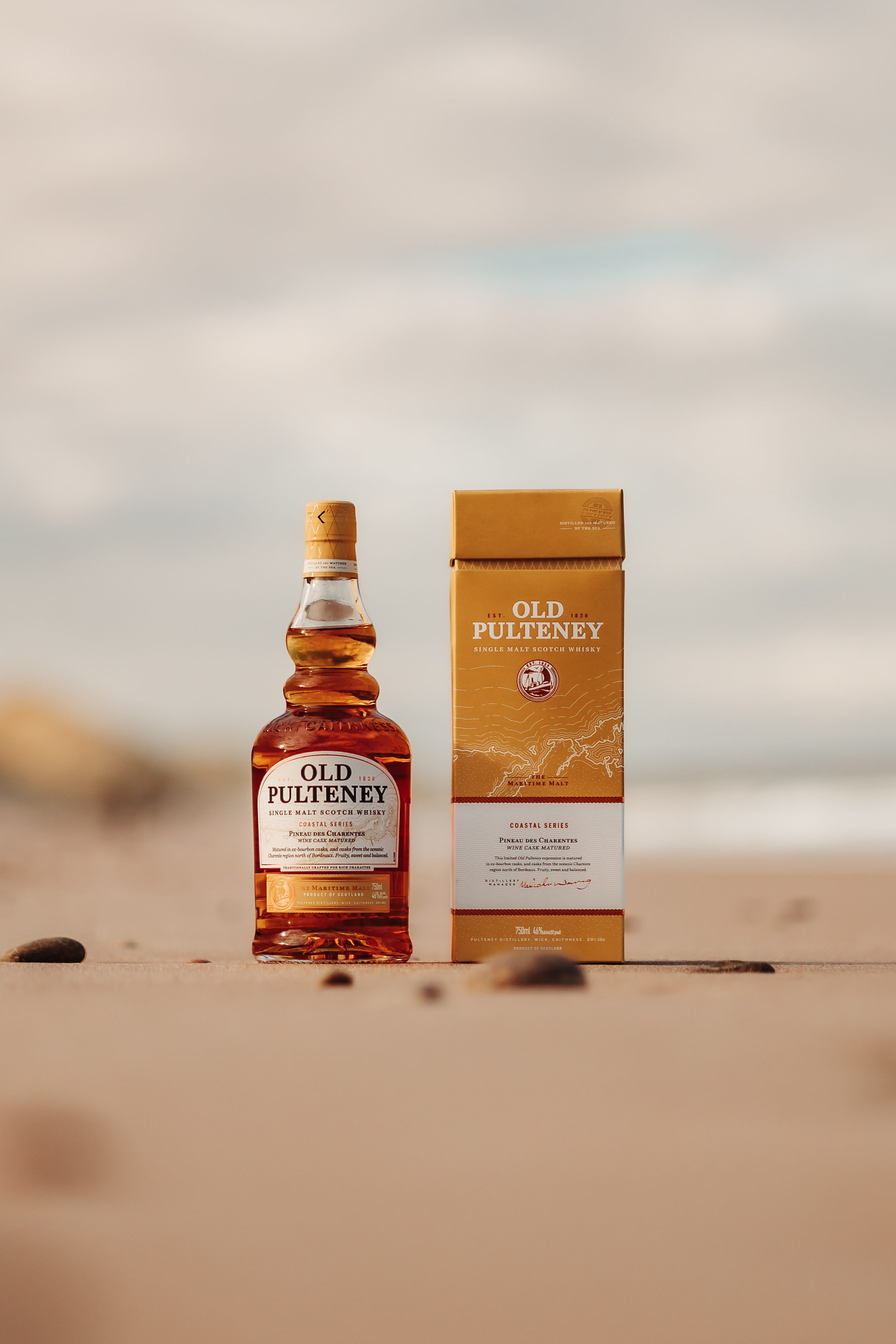 Whisky Bottle and box on the ocean side