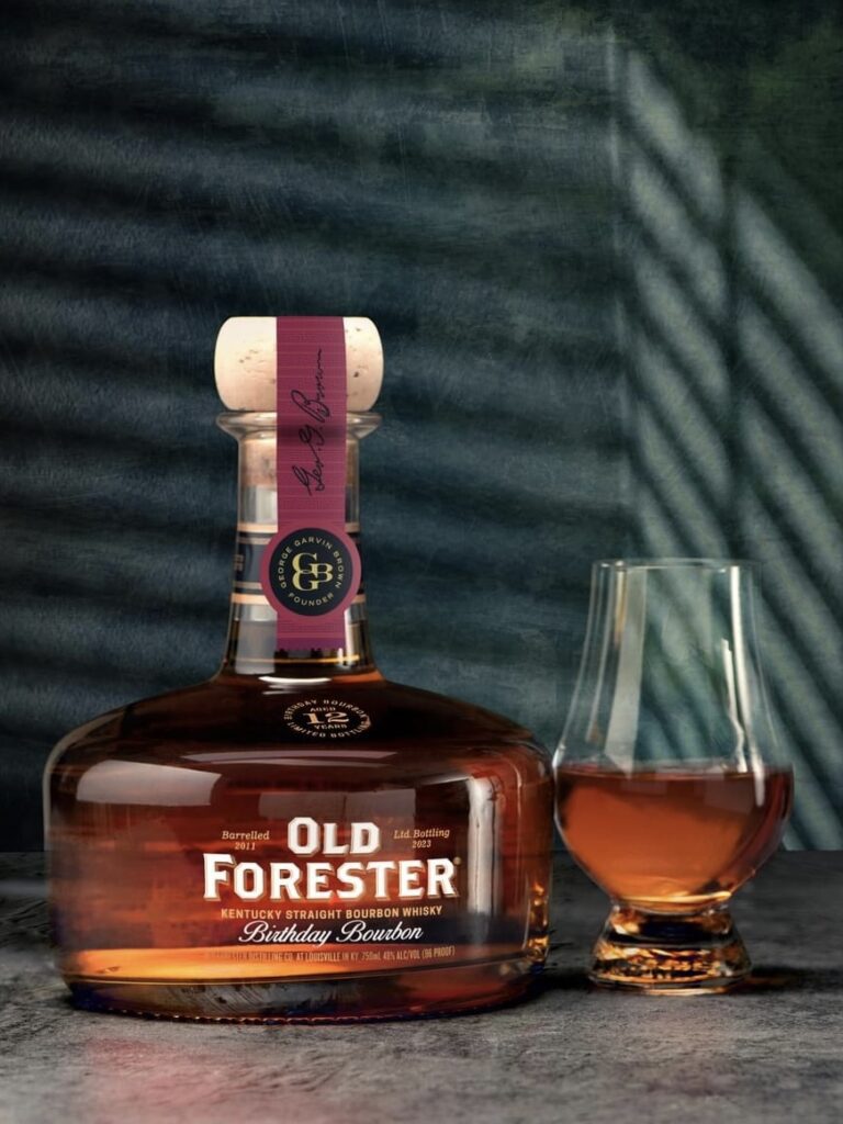 An image of the bottle of Old Forester Birthday Bourbon 2023 Release with a glass of whiskey.