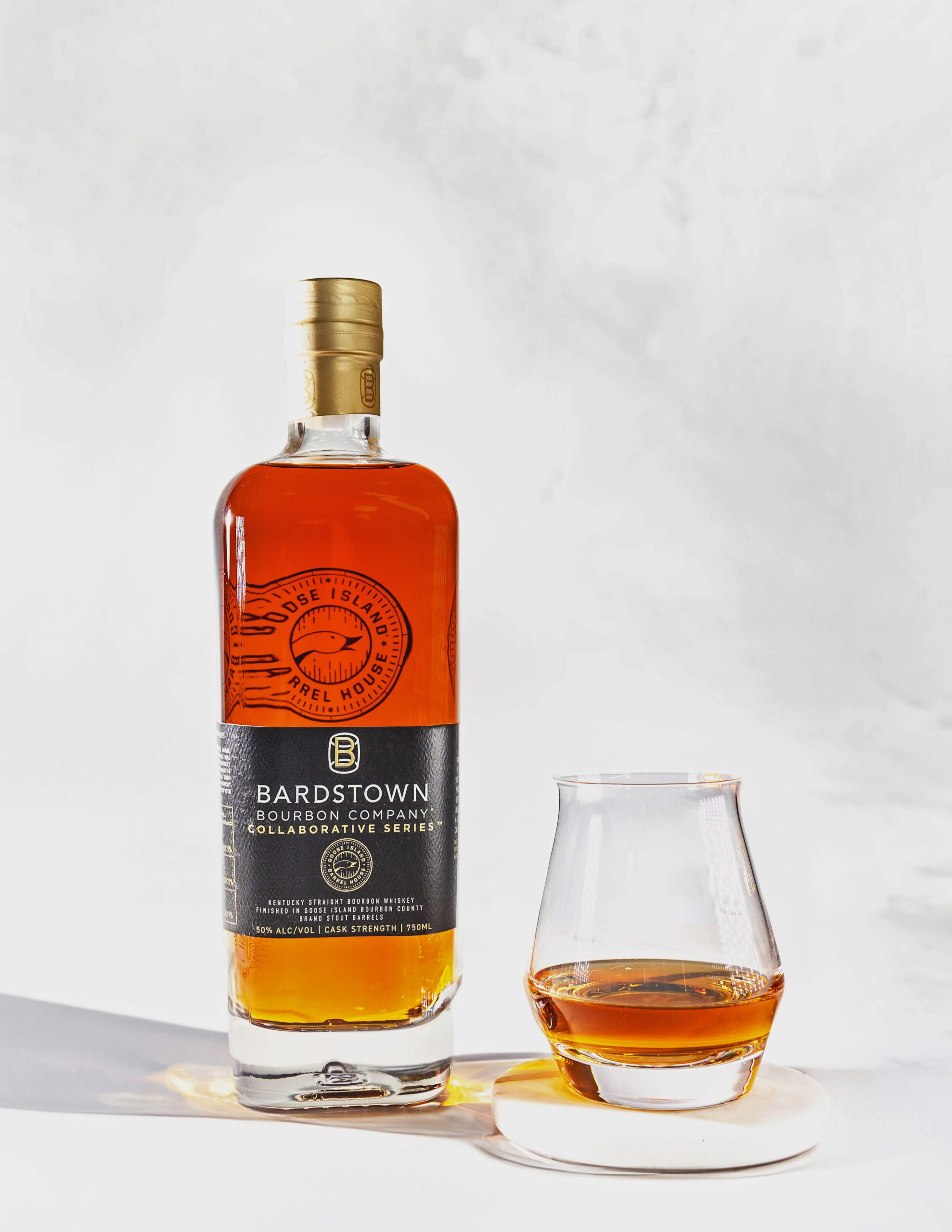 Bardstown Bourbon Company Collaborative Series bottle with glass of bourbon.