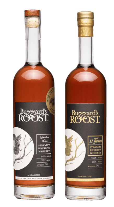 Buzzard’s Roost 7-year-old and 11-year-old double-oaked bourbons on display, showcasing their rich amber color and elegant bottle design at Whiskey Row.