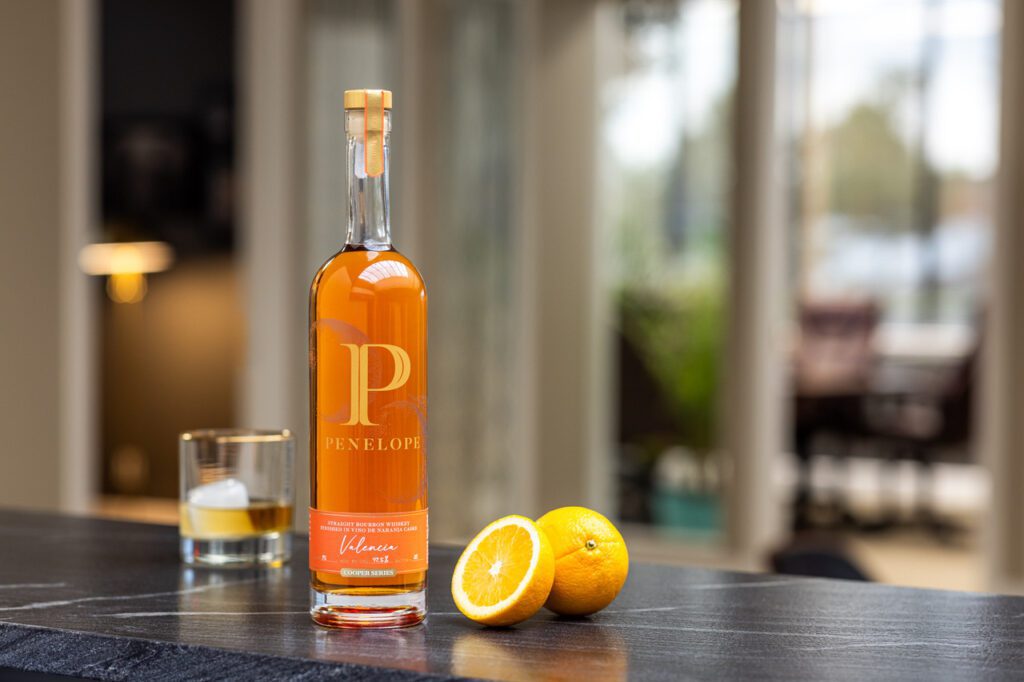 Penelope Valencia Bourbon bottle showcasing the fusion of American bourbon with Spanish Vino de Naranja casks, highlighting its rich citrus notes.