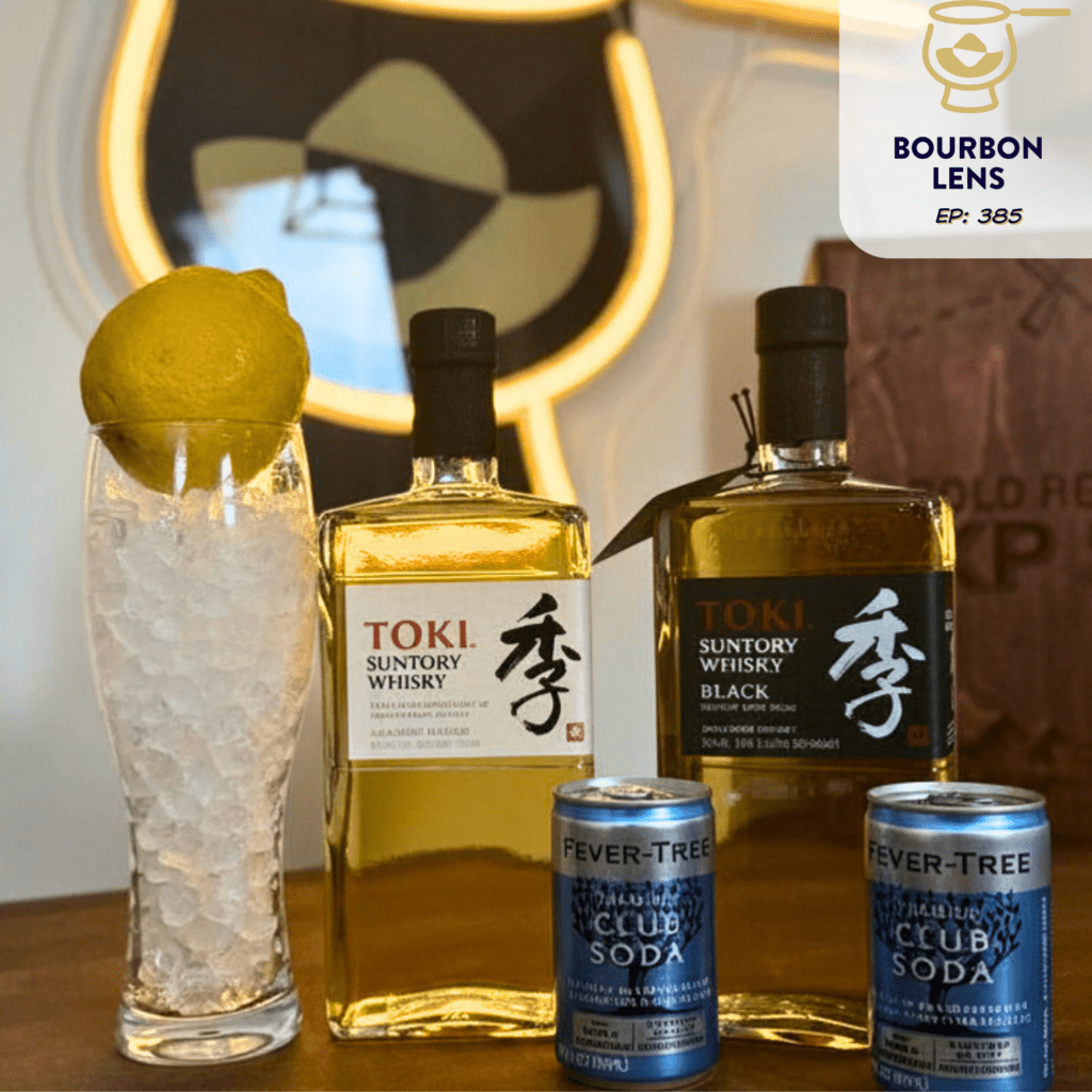 Toki White and Toki Black with a glass of ice, lemon, and two cans of soda water.